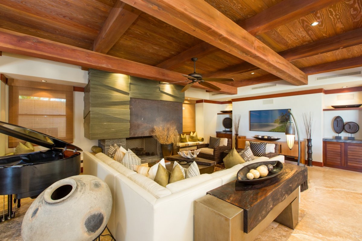 Living room with grand piano and fireplace