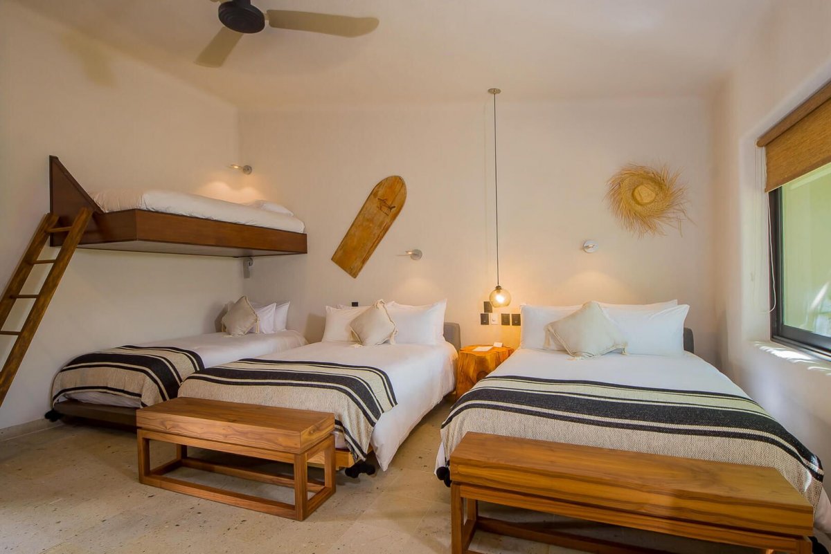 There is more than enough sleeping space at Casa Naah Payil with this room's twin bunk beds and 2 double beds!