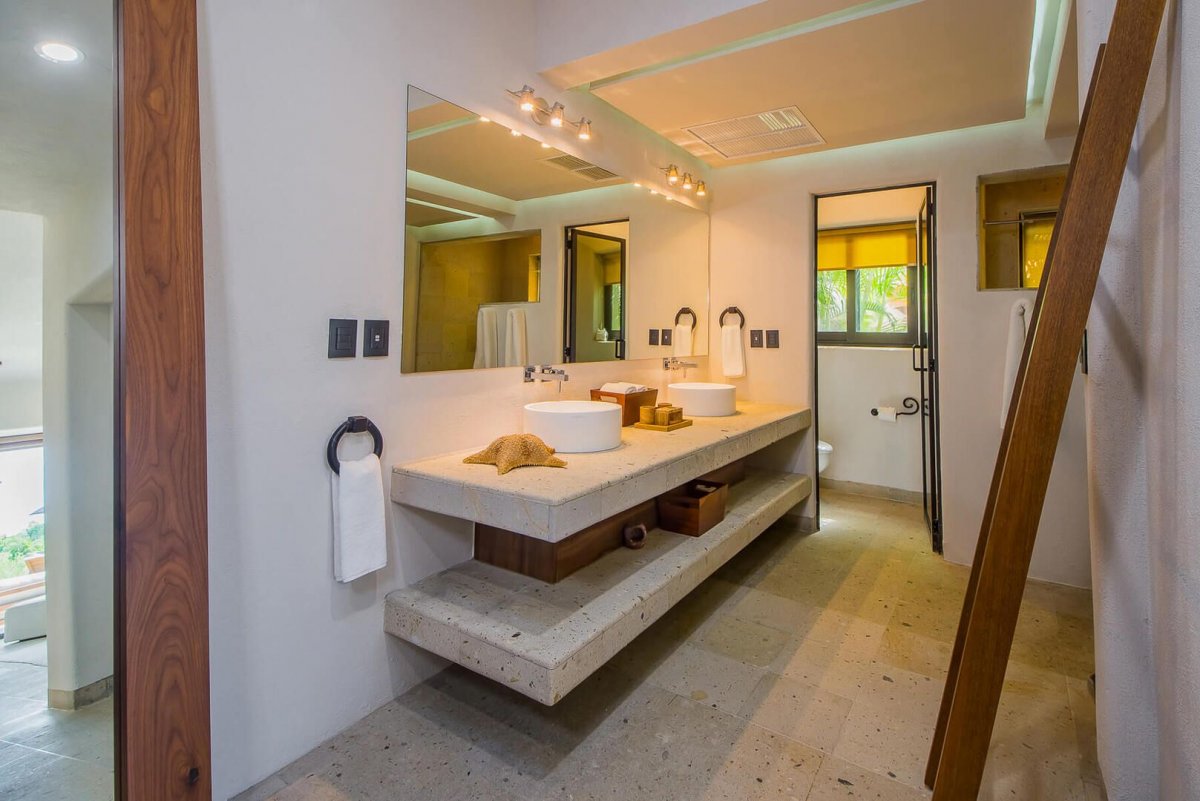 The sophisticated minimalism of Casa Naah Payil flows throughout the villa including the five bathrooms!