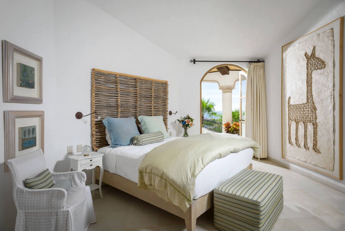 Crisp white walls help to make the bedrooms of Villa Buena Vida appear even more spacious and open!