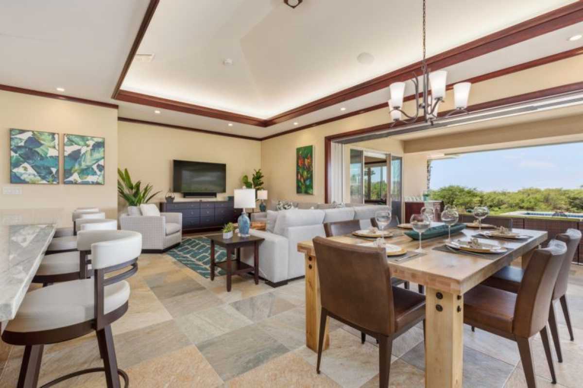 Entertain with ease—sectional seating, a bar, and sliding doors to ocean views make this villa perfect for gatherings!