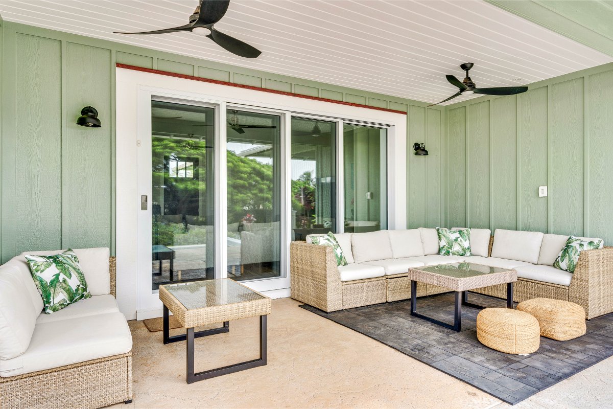 Spacious lanai with comfortable seating, perfect for relaxation and enjoying the breeze.