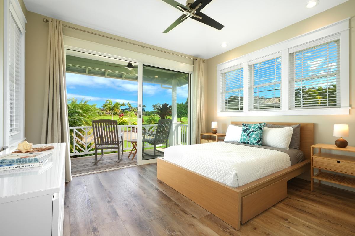 Downstairs bedroom 2 with AC, lanai, and ensuite bathroom.