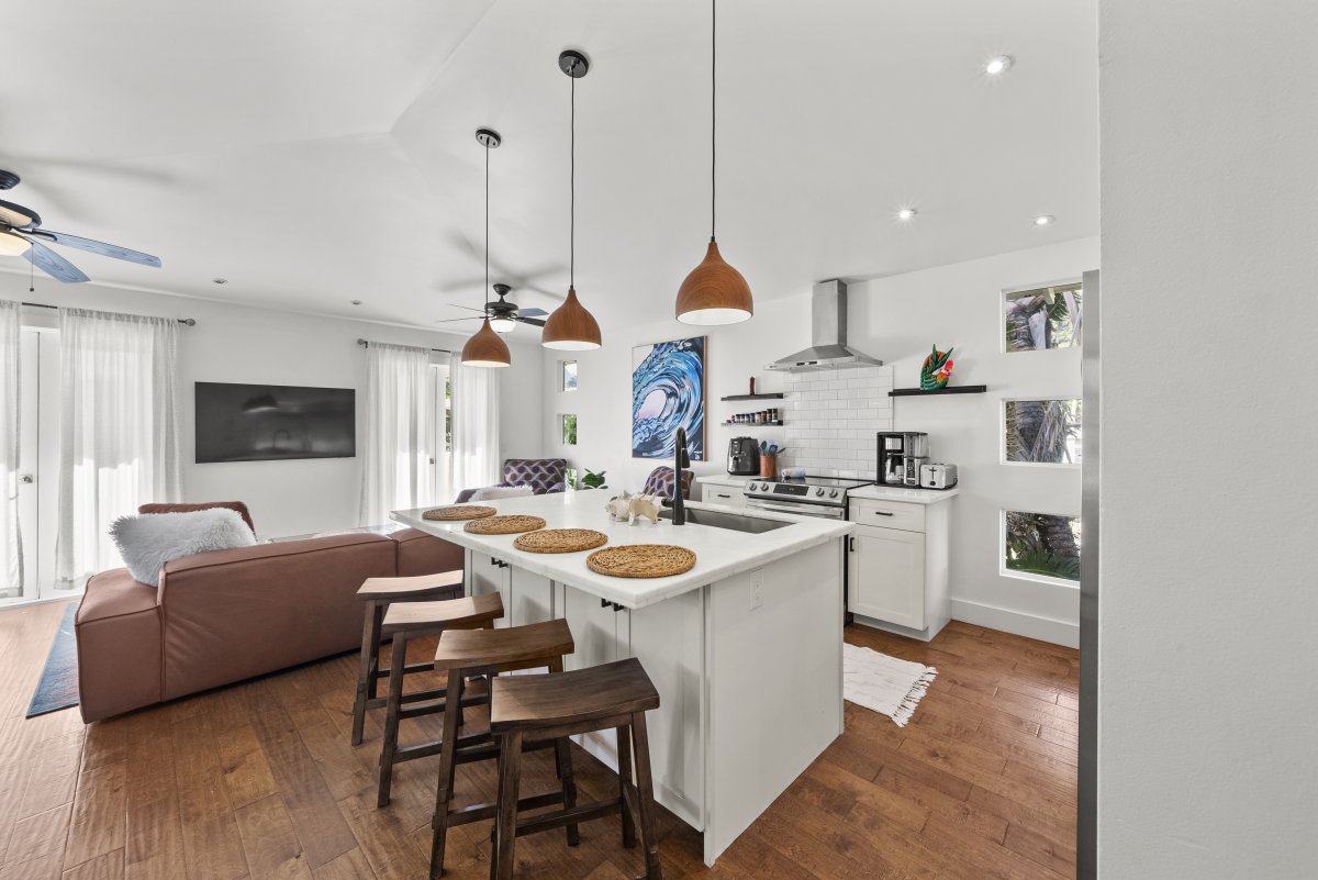 Kitchen island/bar with four seats for quick meals or entertainment.