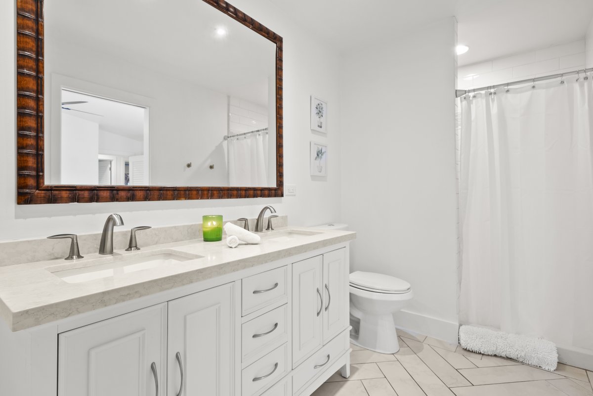 Dual sinks with a separate shower.