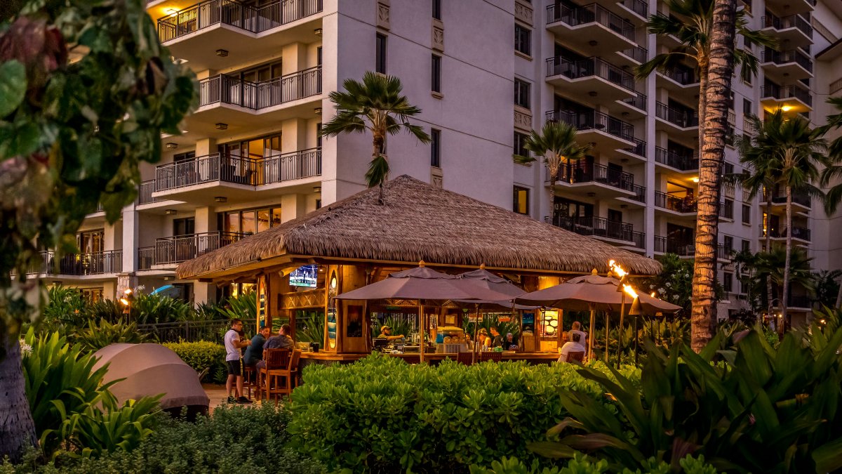 The beach bar is full of twinkling lights by the sea.