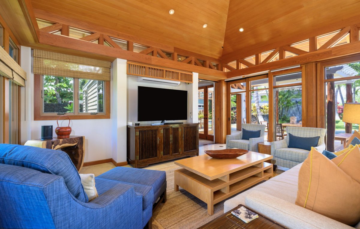 Bright and airy living area with expansive windows and sliding doors that fill the room with natural light.