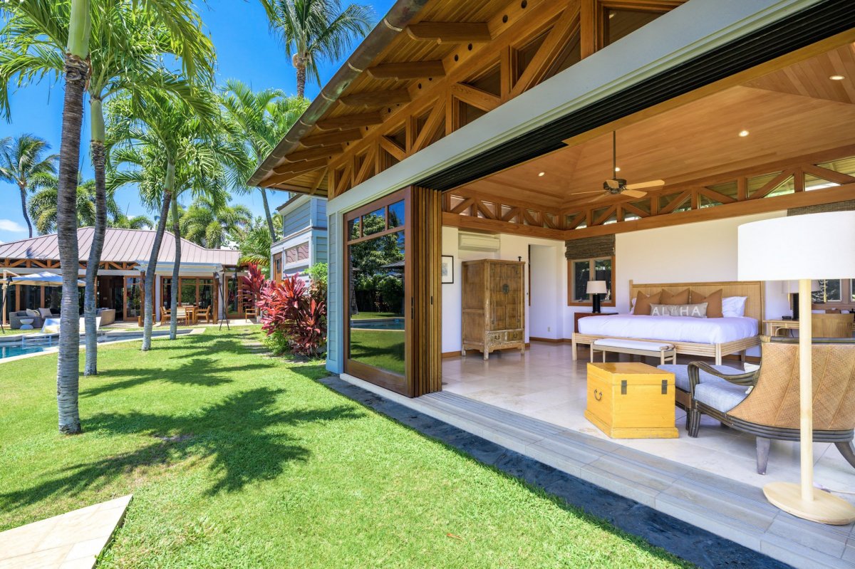 The primary suite opening directly to the pool for seamless indoor-outdoor living.