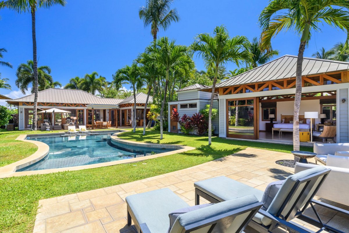 Sun loungers by the poolside offering a perfect way to relax and enjoy the island breeze.