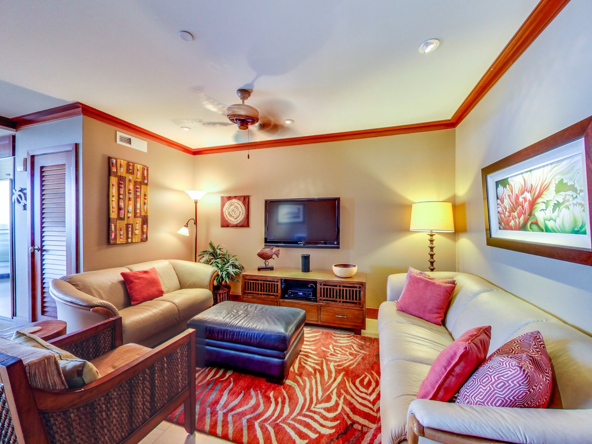 A cozy living area with leather sofa and loveseat.