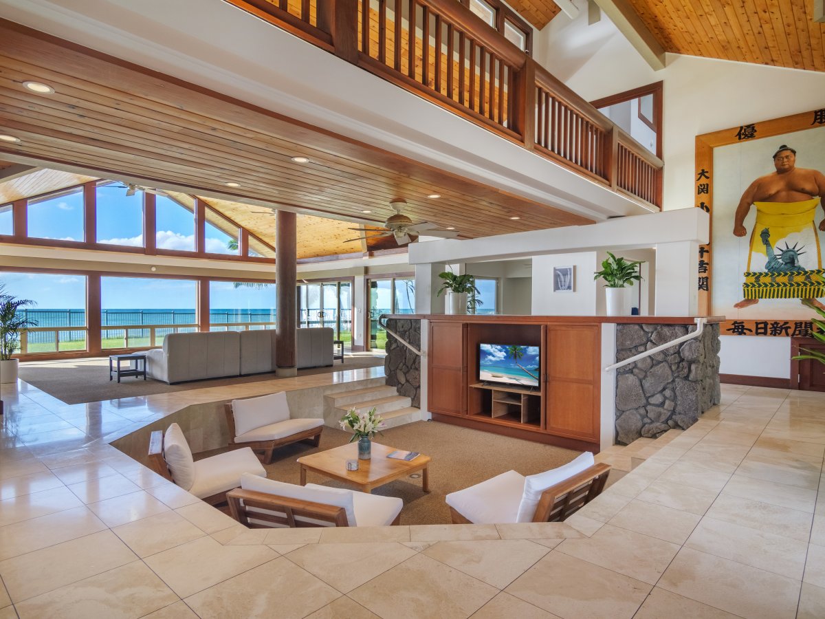 Cozy sunken living space with wood accents and modern amenities for family entertainment.