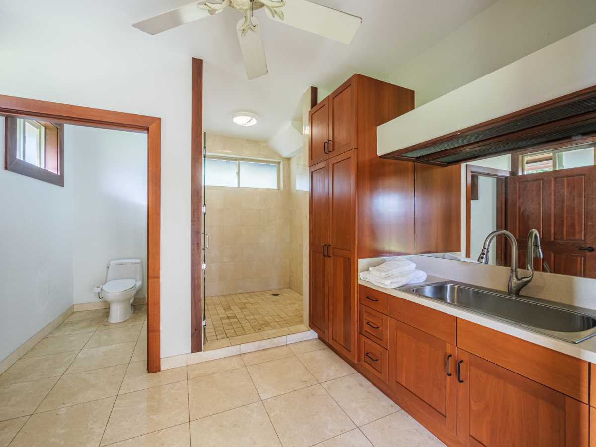 Ensuite bathroom with an enclosed walk-in shower, closet and wide vanity area.