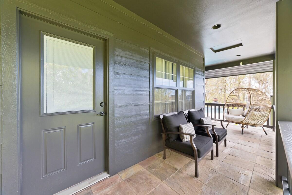 Covered lanai off primary "lodge" bedroom leading to pool area.