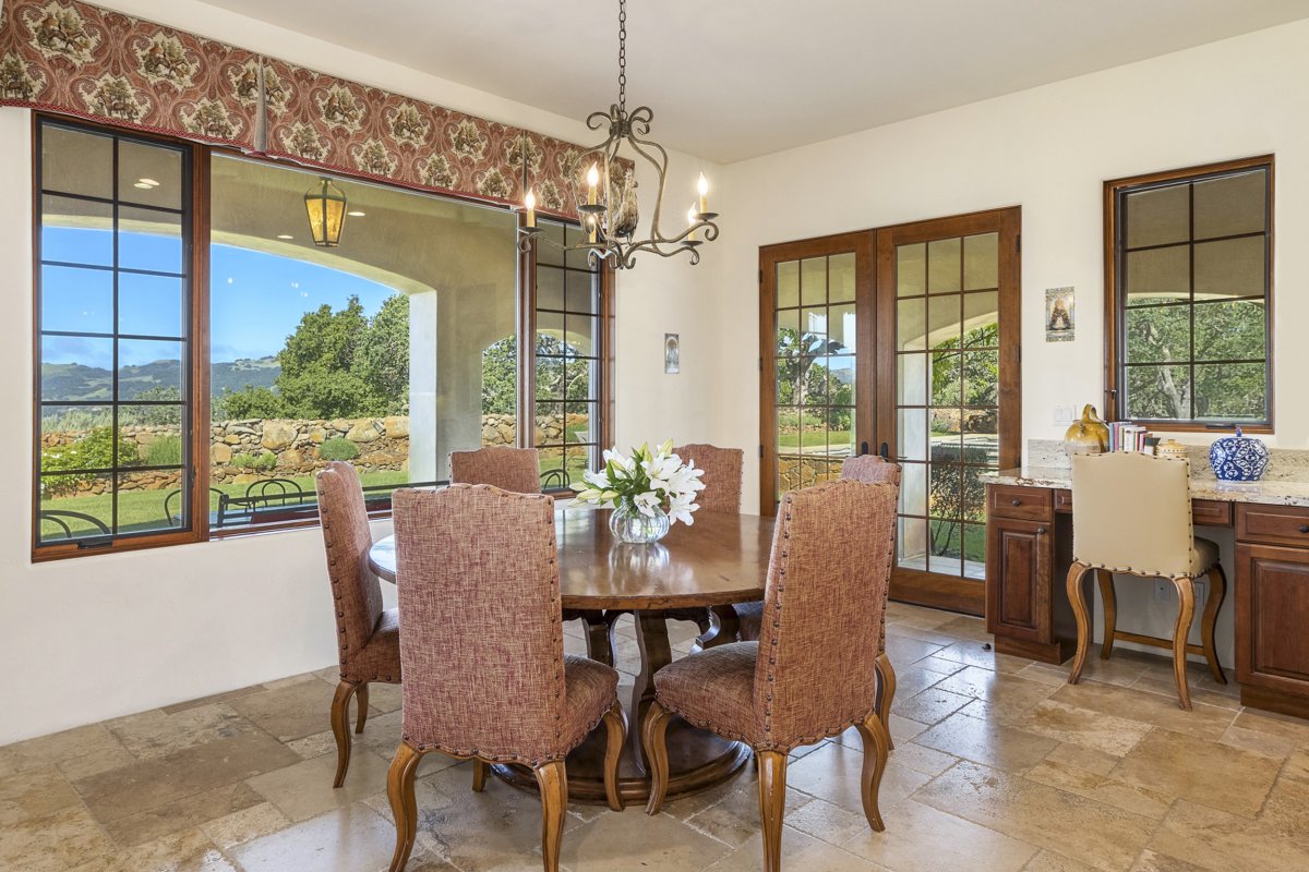 Breakfast Table with views of the backyard and pool.