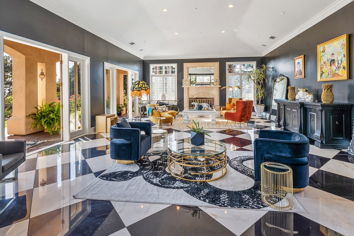 The entry is absolutely gorgeous and leads into a stunning living room nicknamed "Grand Gatsby".