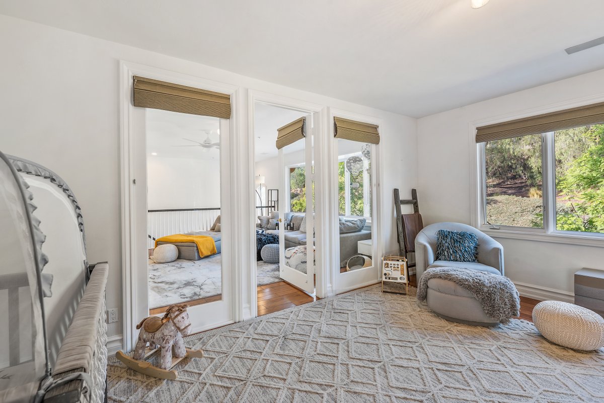 Informal living room connects to The Nursery, nicknamed "Worldliness Adventures".