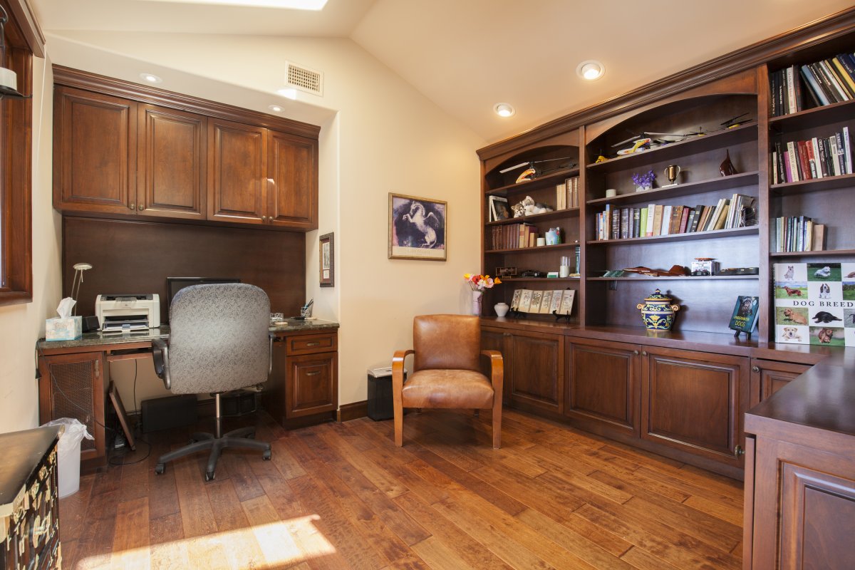 Home office space with library and computer