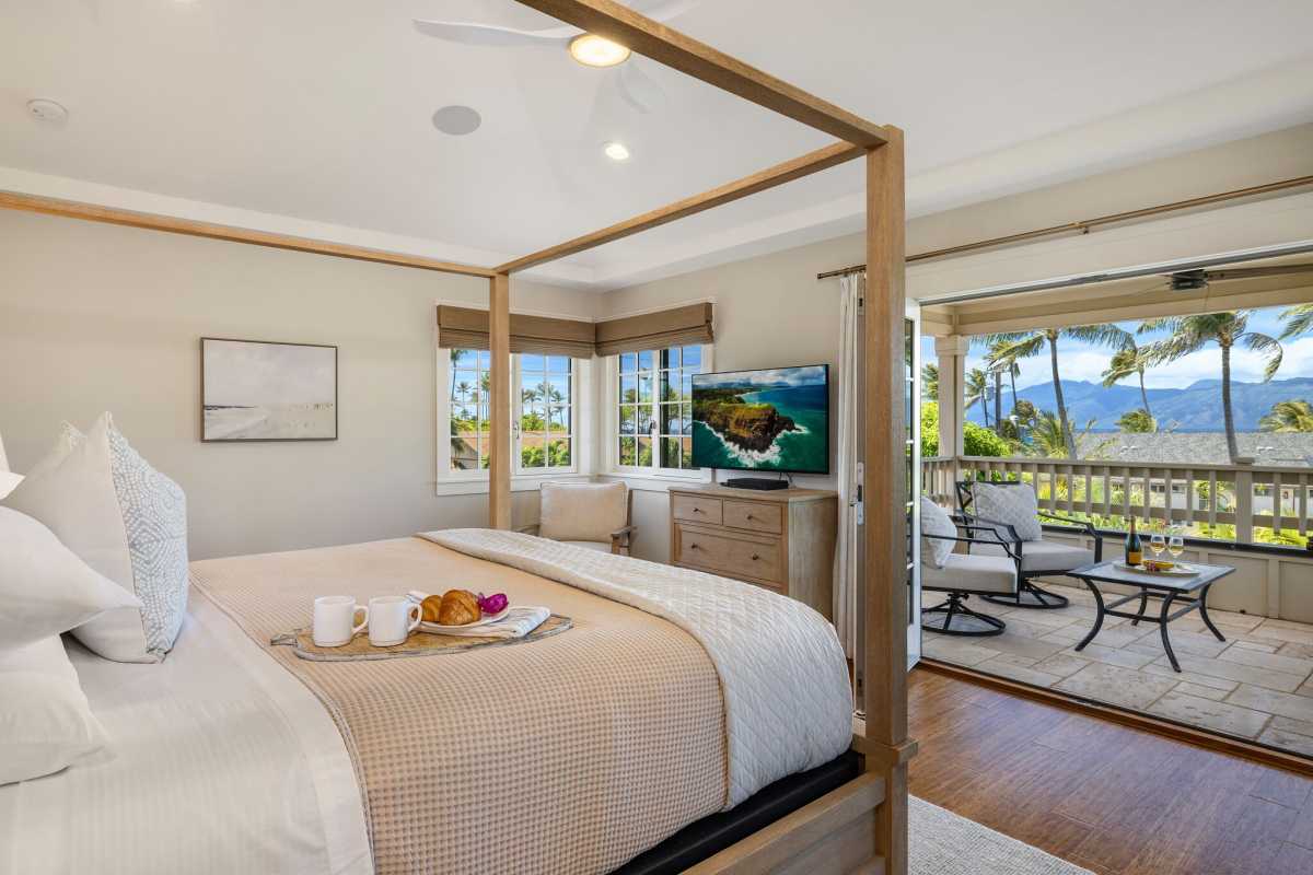 The primary bedroom with private lanai and ocean views