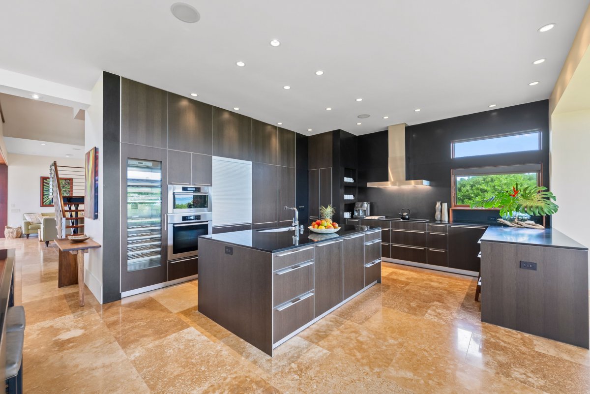 The kitchen features top of the line appliances and wide counter spaces to make meal prepping a breeze.