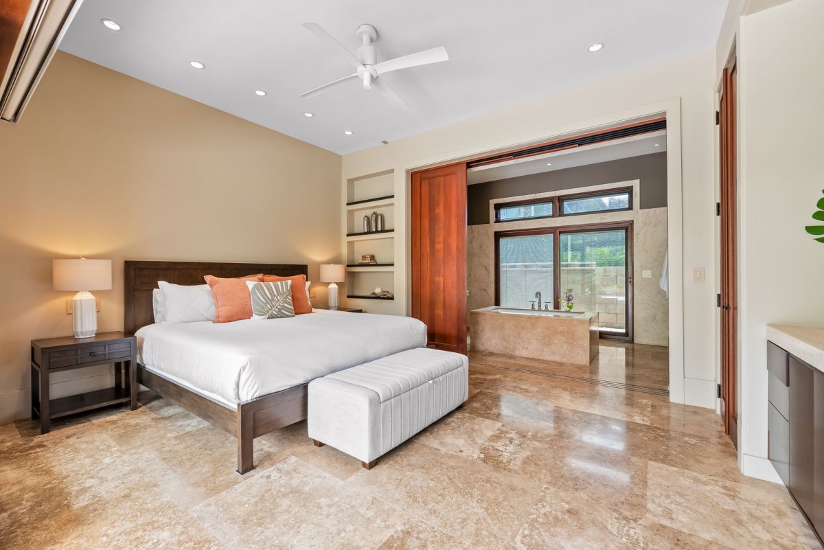 The guest suite two offers a king-sized bed, ceiling fan and an ensuite bathroom.