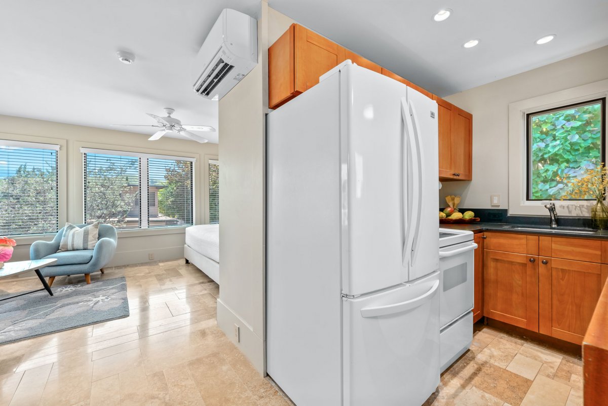 The studio apartment also features a kitchenette for convenience.