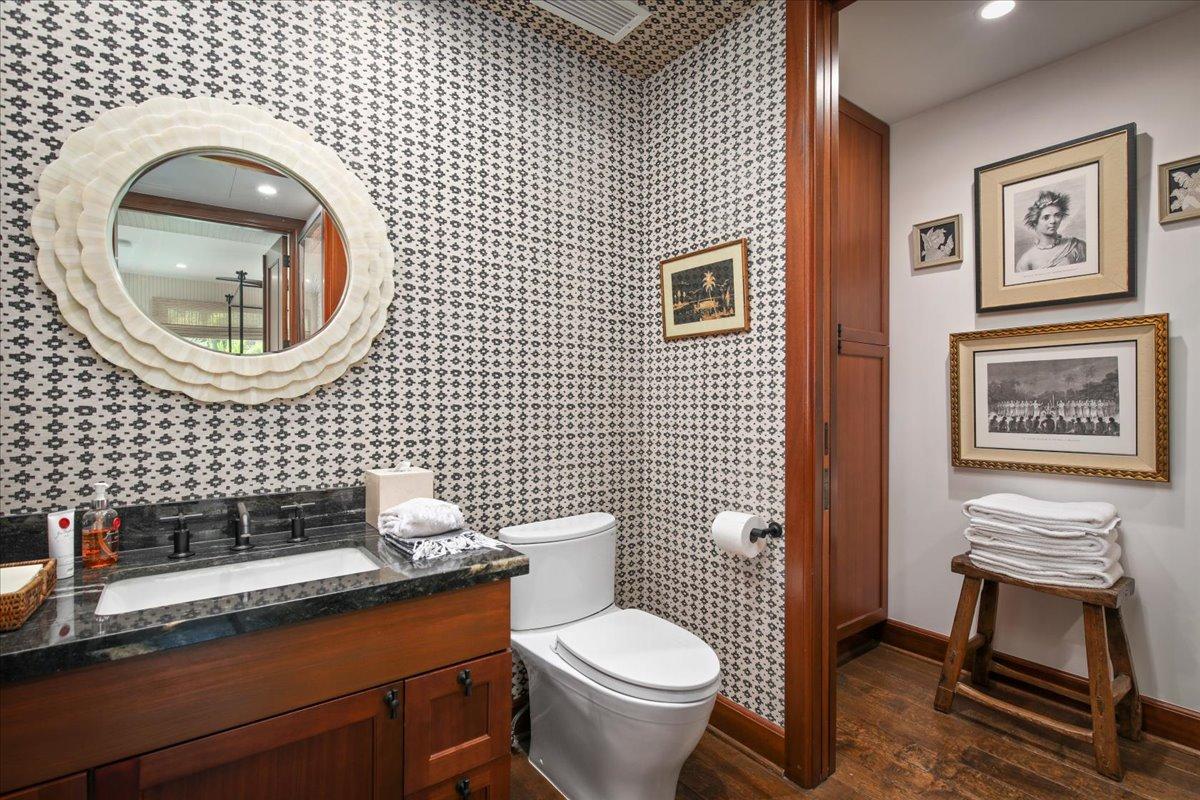 The shared full bathroom with a single vanity and separate shower serves the upstairs bedrooms.