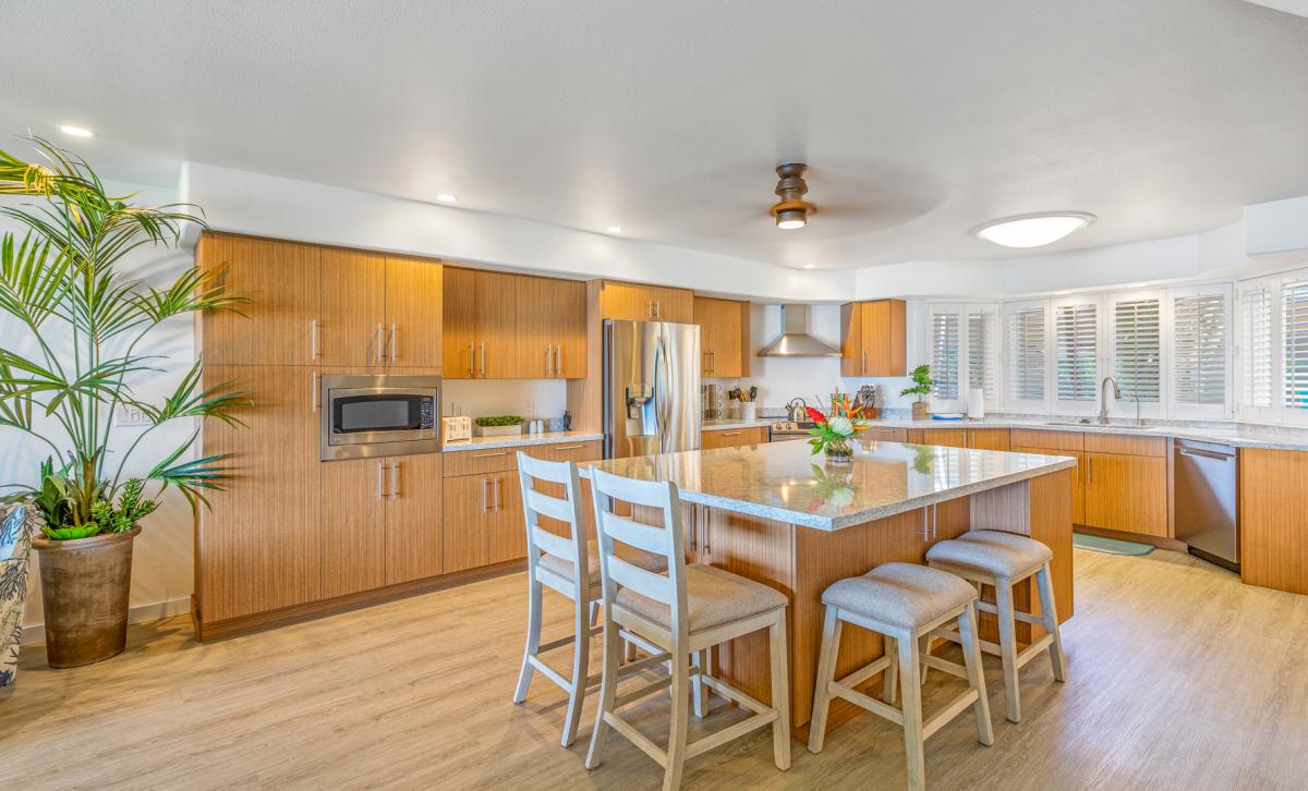 The kitchen island is a perfect spot for quick meals and entertainment.