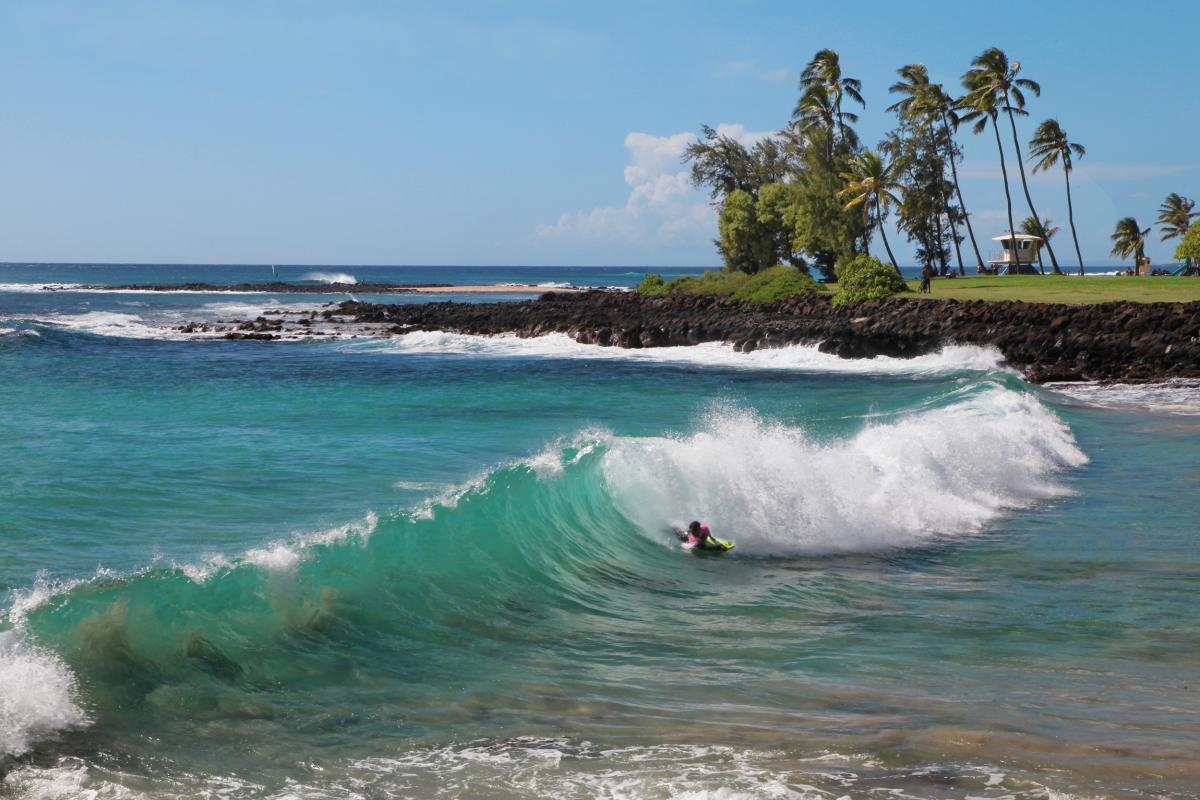 Ride the waves or watch bodyboarders in action at Brennecke's Beach, a thrilling spot for water sports enthusiasts.