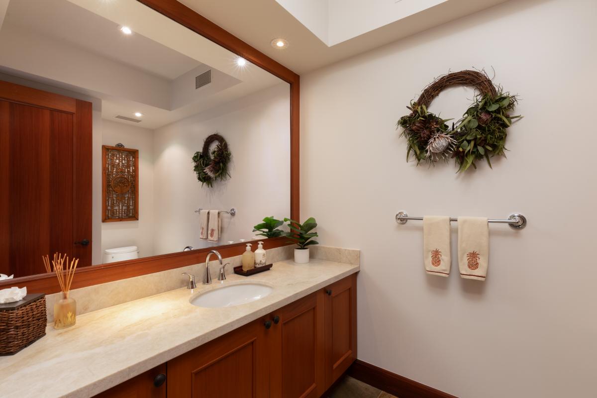 Elegant bathroom with a walk-in shower featuring natural stone tiles.