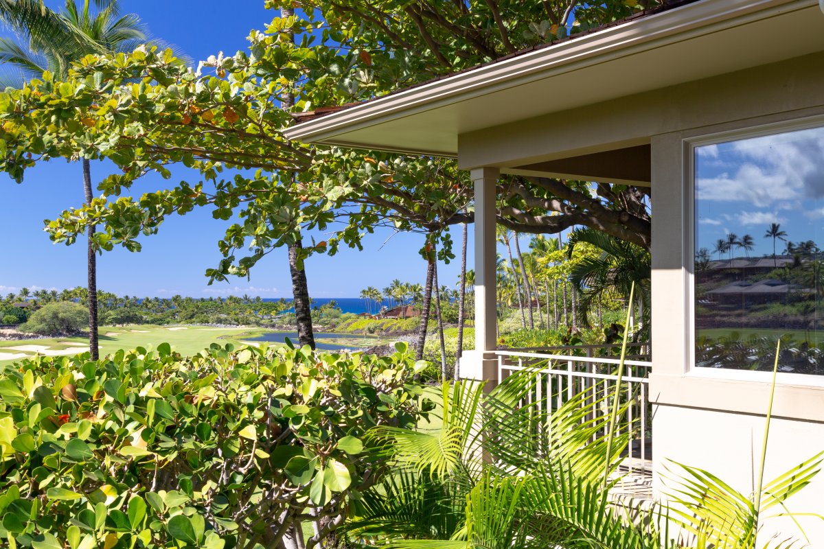Serene balcony view surrounded by lush greenery and vibrant tropical landscapes.
