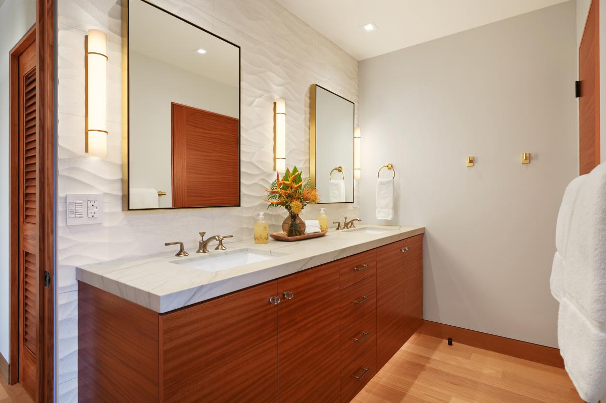 Elegant bathroom with a double vanity and sleek modern finishes.