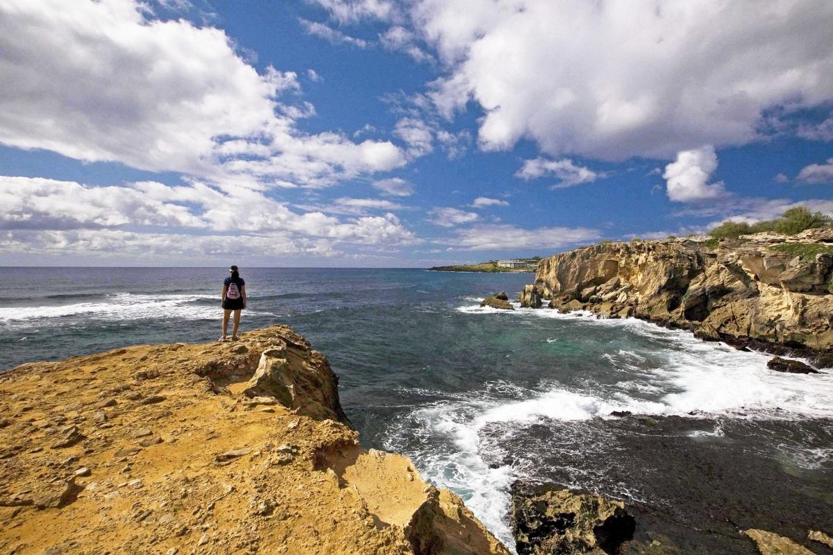 Explore the rugged charm of Mahaulepu Trail with its coastal cliffs and ocean views.