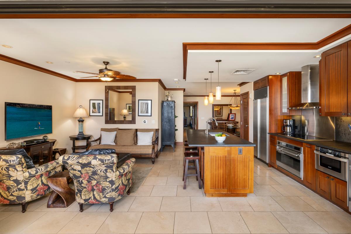 Looking at the open concept plan with seamless connection between the dining, kitchen and living areas.