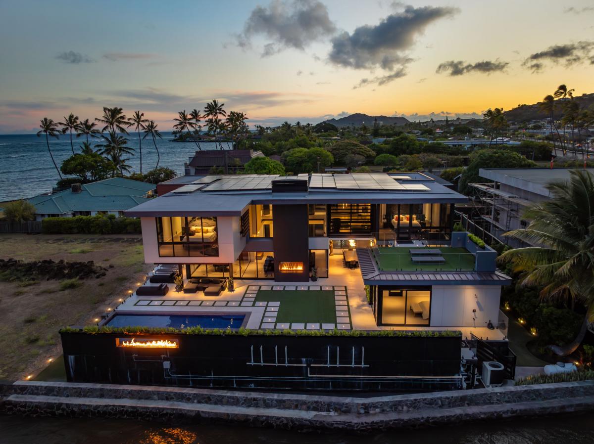 Ocean Villa Emilie illuminated at dusk—every detail designed for unforgettable evenings on Oahu.