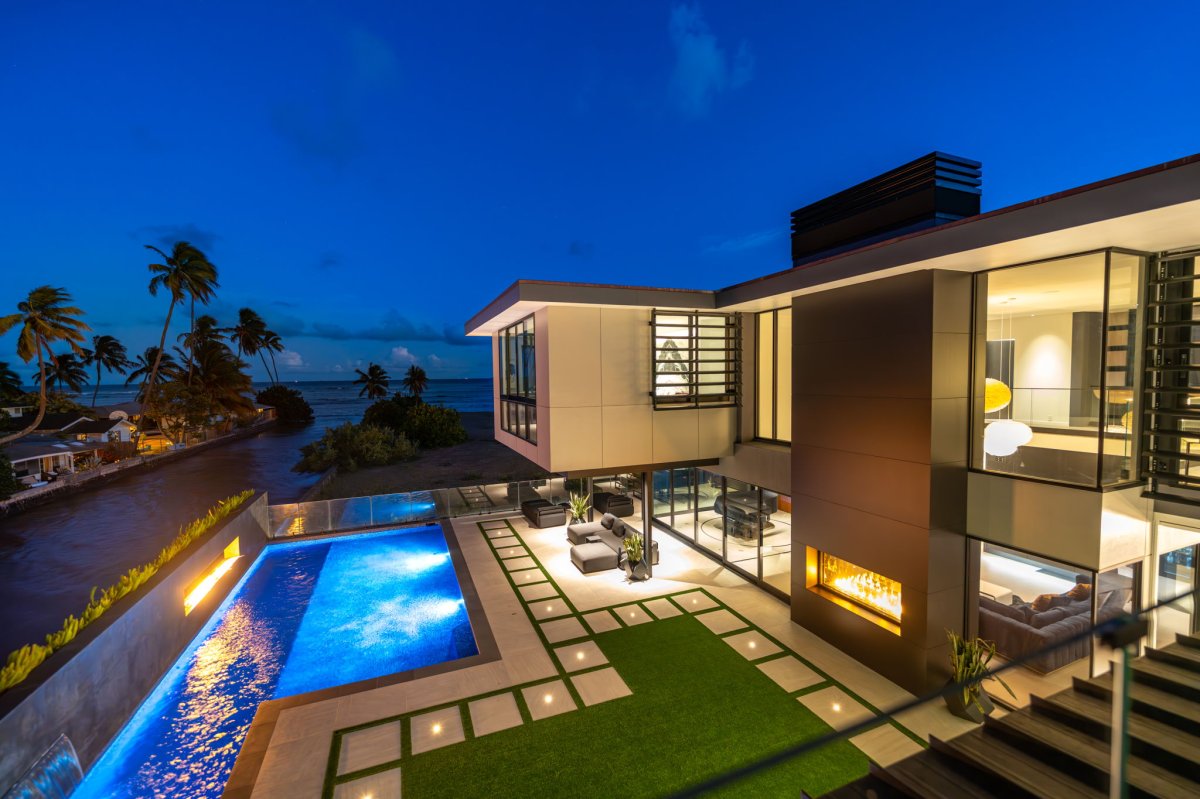 Twilight transforms the estate into a glowing retreat—perfect for evening swims, dinners under the stars, or entertaining with flair.