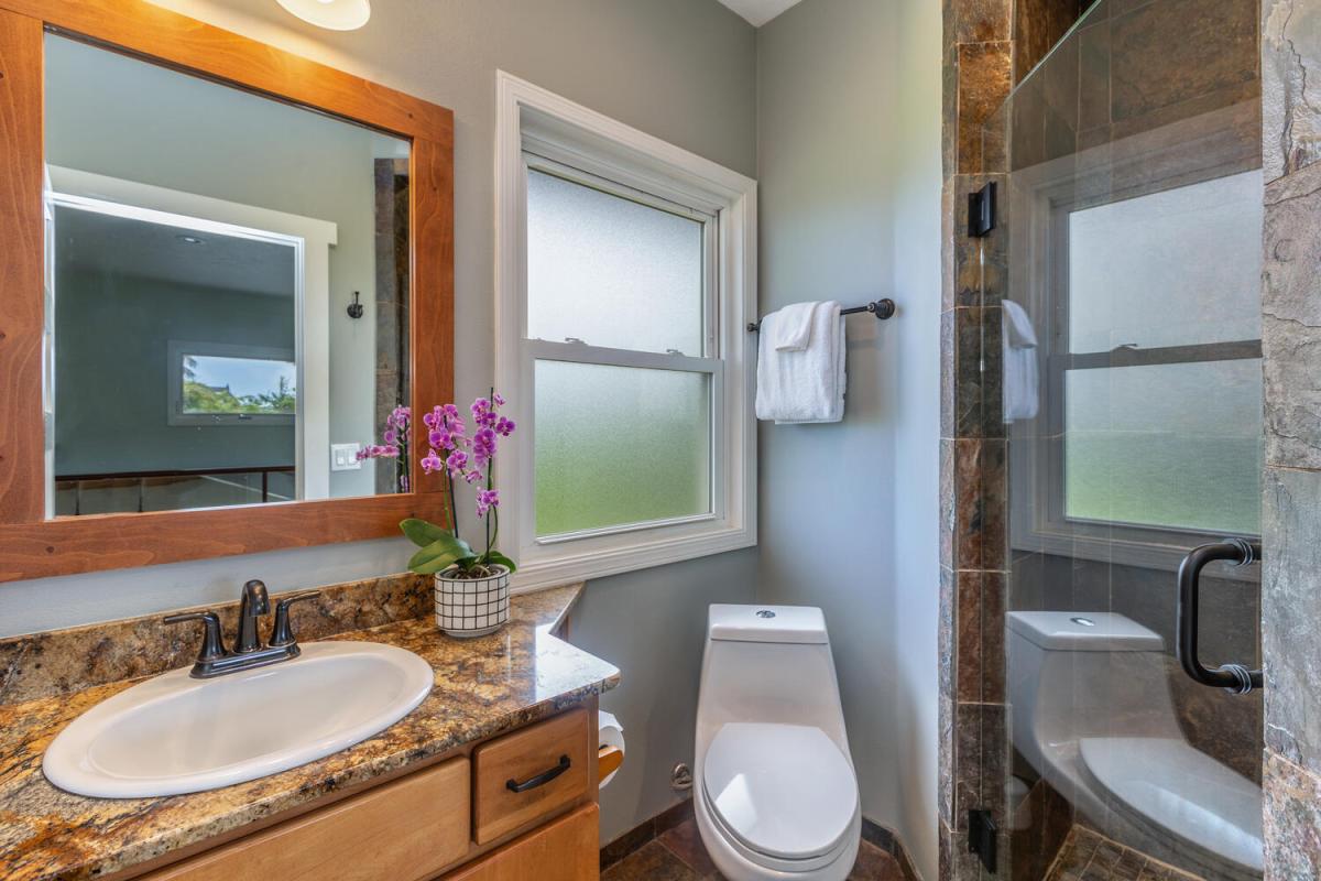 The upstair hallway bathroom has a single vanity.