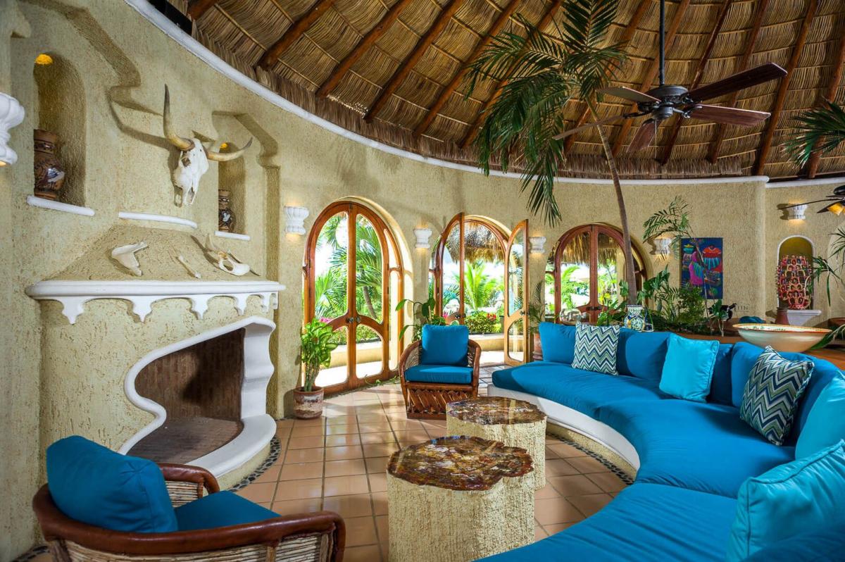 Gather around the fireplace on those chiller Cabo nights at Villa Las Rocas spacious seating area.