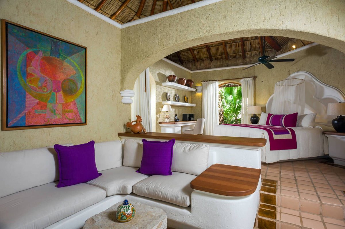 All rooms have a separate seating area with plush couches and unique stone tables.