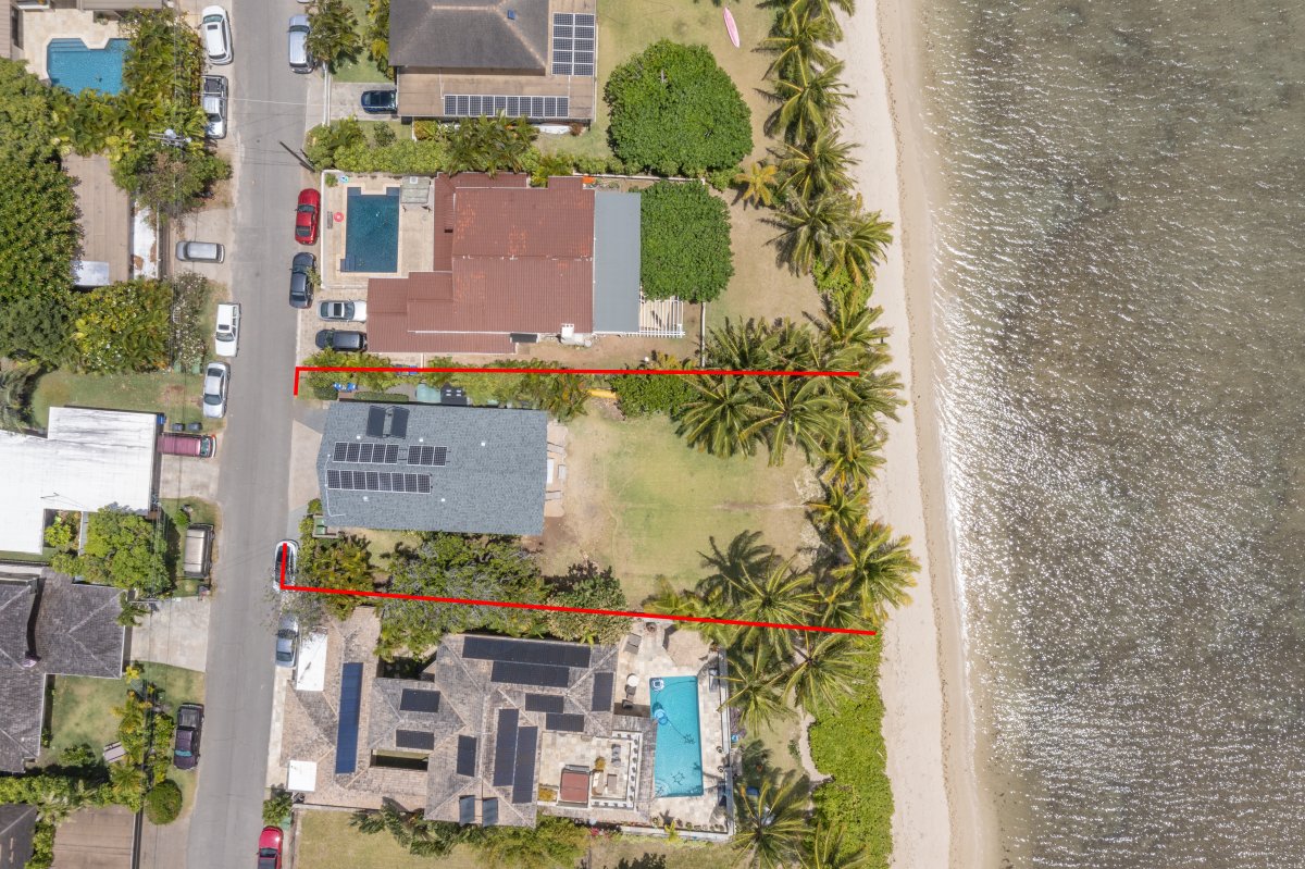 Bird’s-eye view of the beachfront property and its surrounding neighborhood.