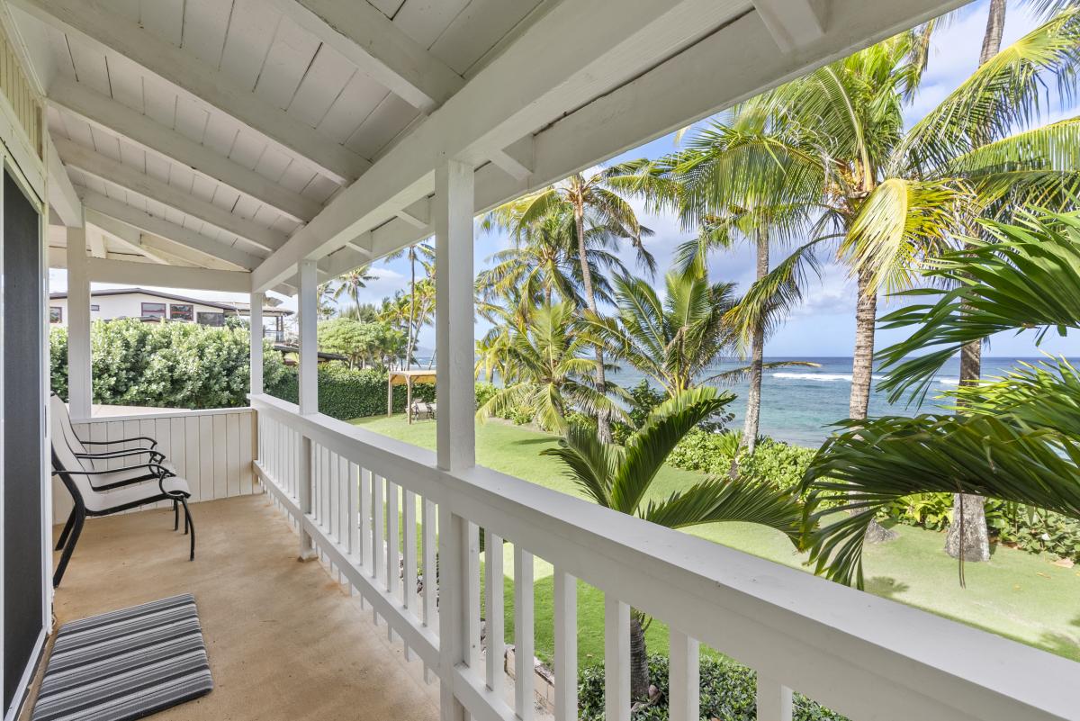 Relax on the breezy lanai with views of swaying palms and the ocean.