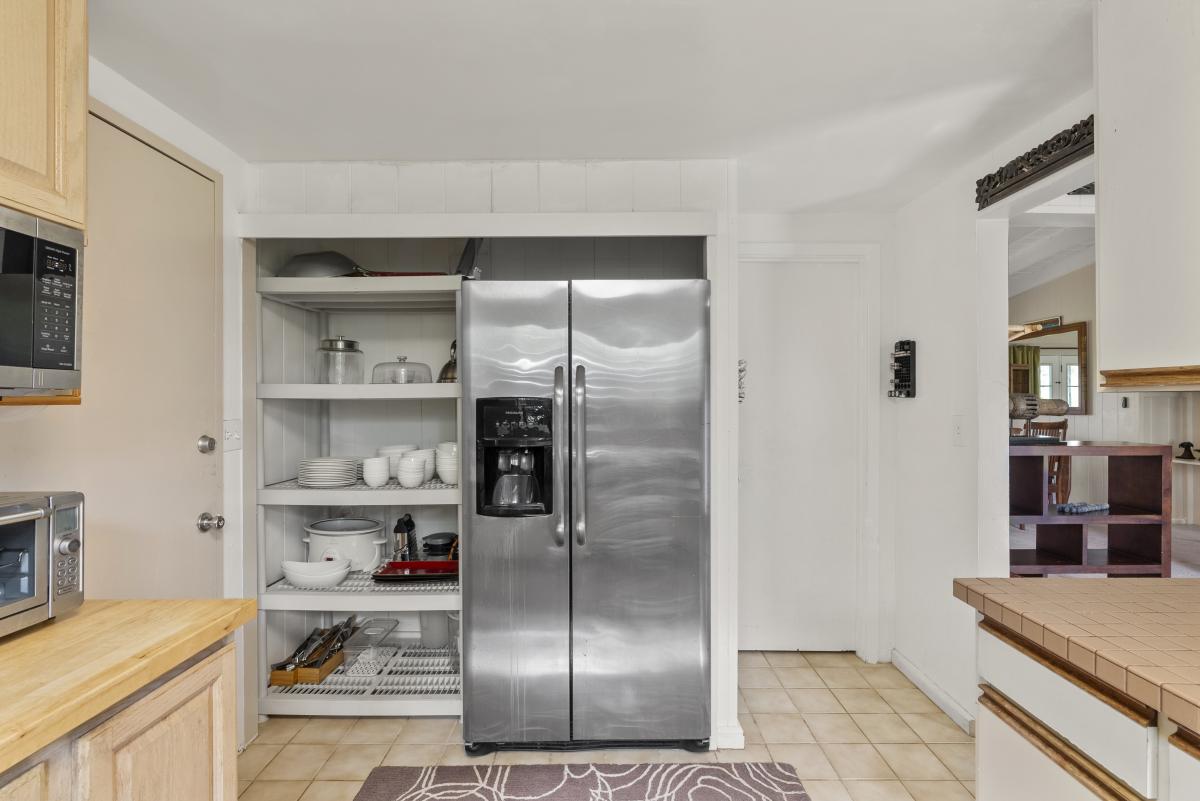 Fully equipped kitchen featuring stainless steel appliances and plenty of counter space.