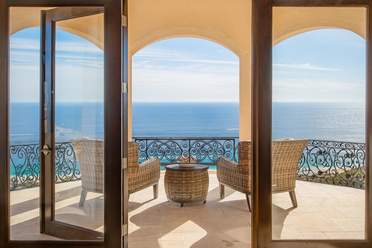 Bedroom suite with private balcony and ocean views