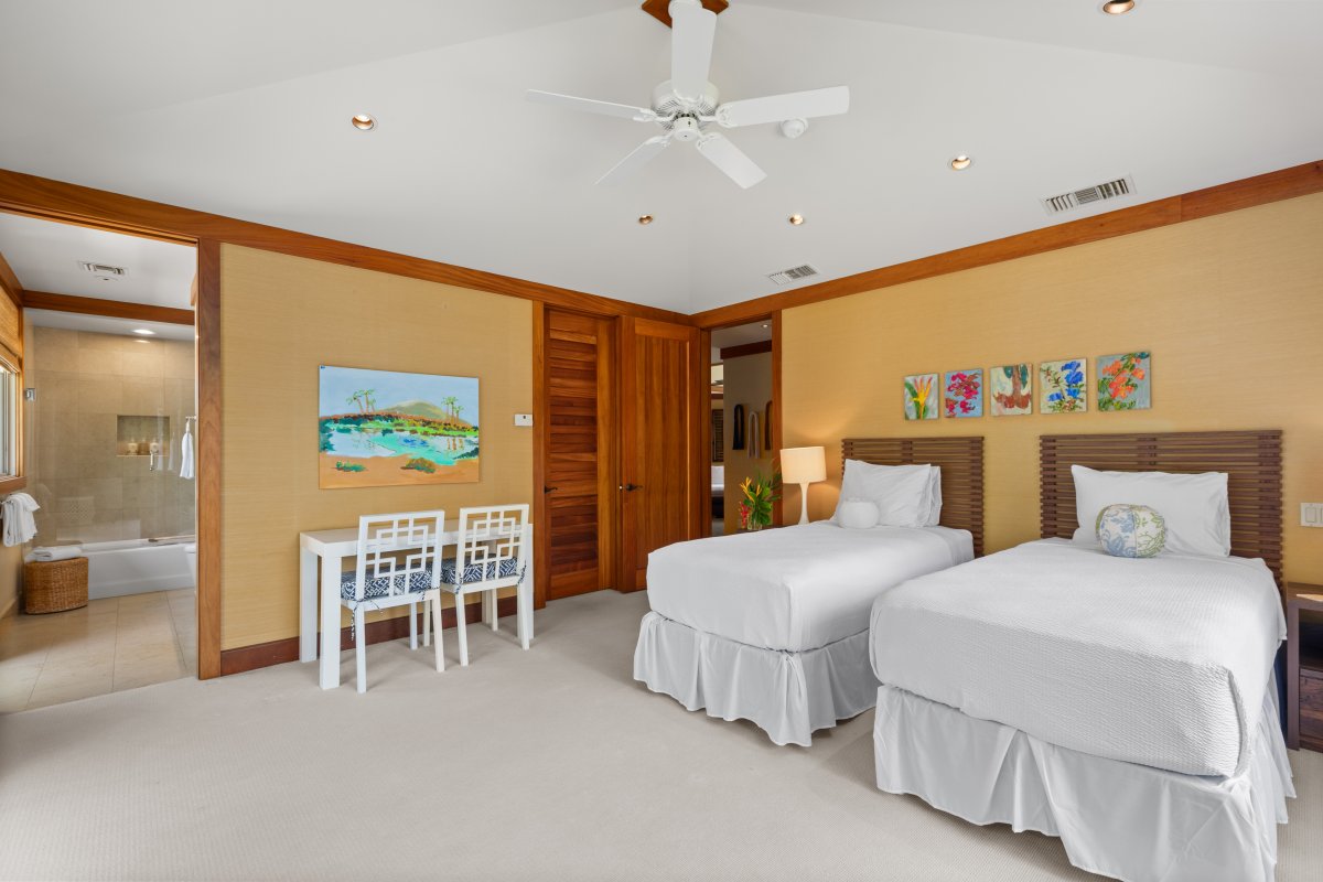 Twin beds with playful touches and desk space—perfect for kids, teens, or flexible sleeping arrangements.