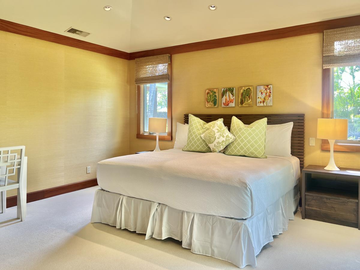 This guest bedroom includes a lanai, en suite bathroom and walk-in closet as well.