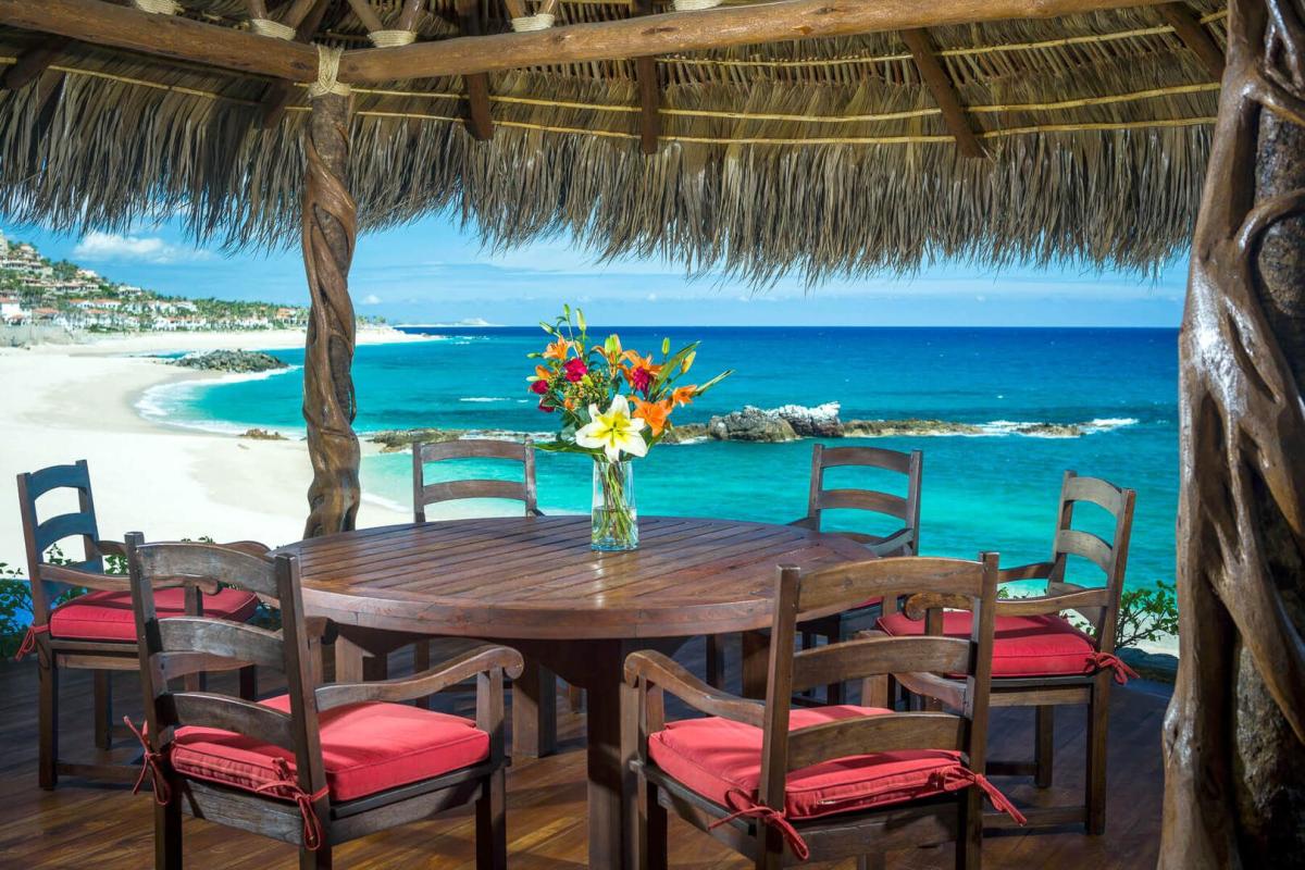 Take in the spectacular ocean view under the villa's open and spacious Palapa