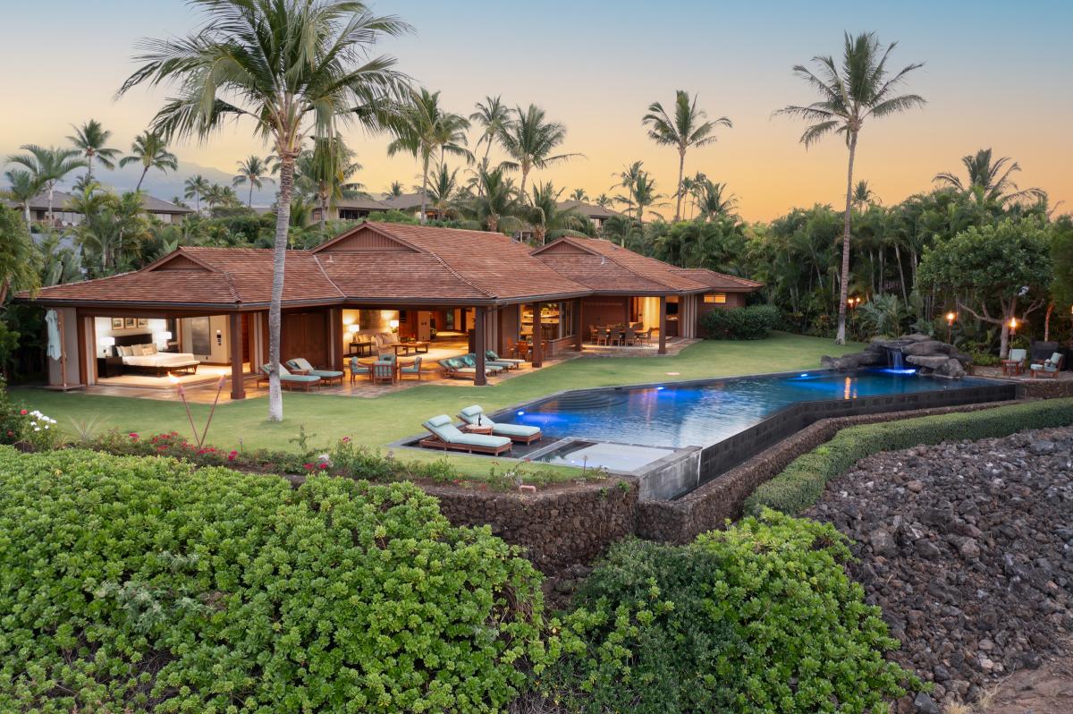 Twilight ambiance at the poolside lanai with glowing sunset skies.