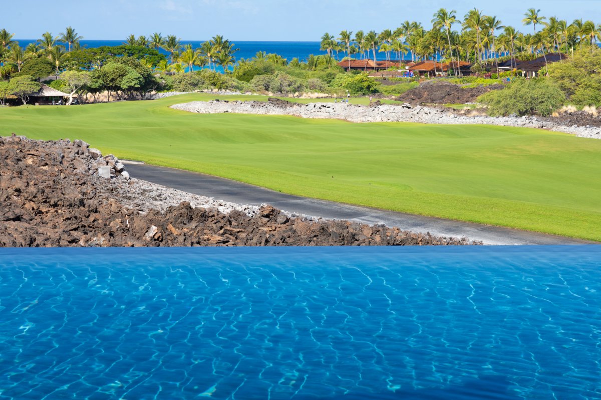 Infinity-edge pool perfectly positioned beside the 6th hole fairway.