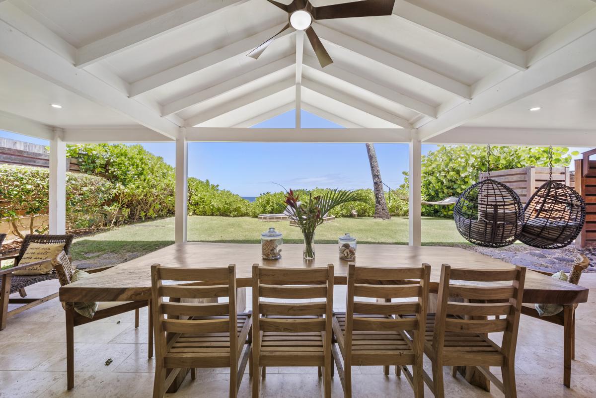Gather for family-style meals on the spacious lanai with ocean breezes and lush surroundings.