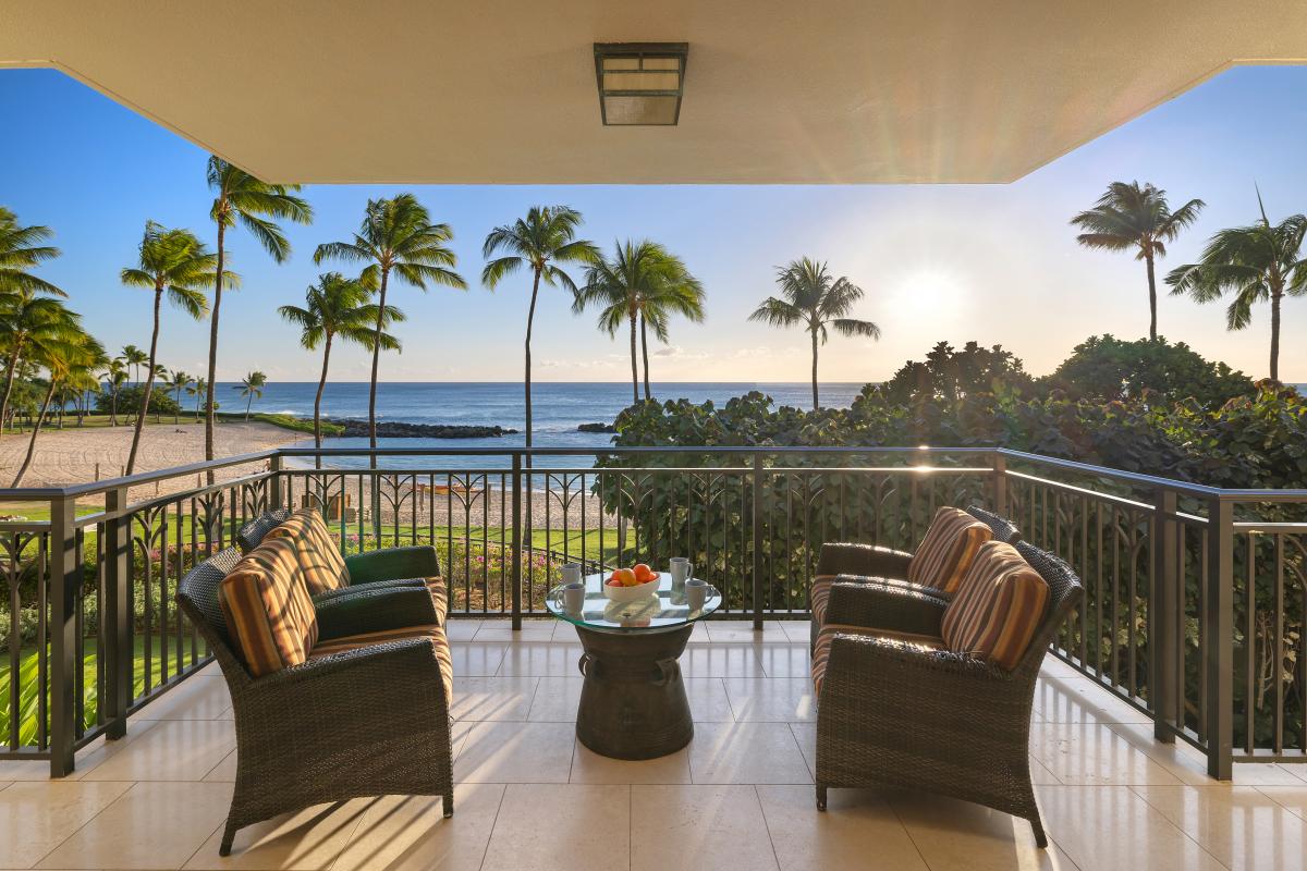 Oceanfront lanai with direct lagoon and sunset views.