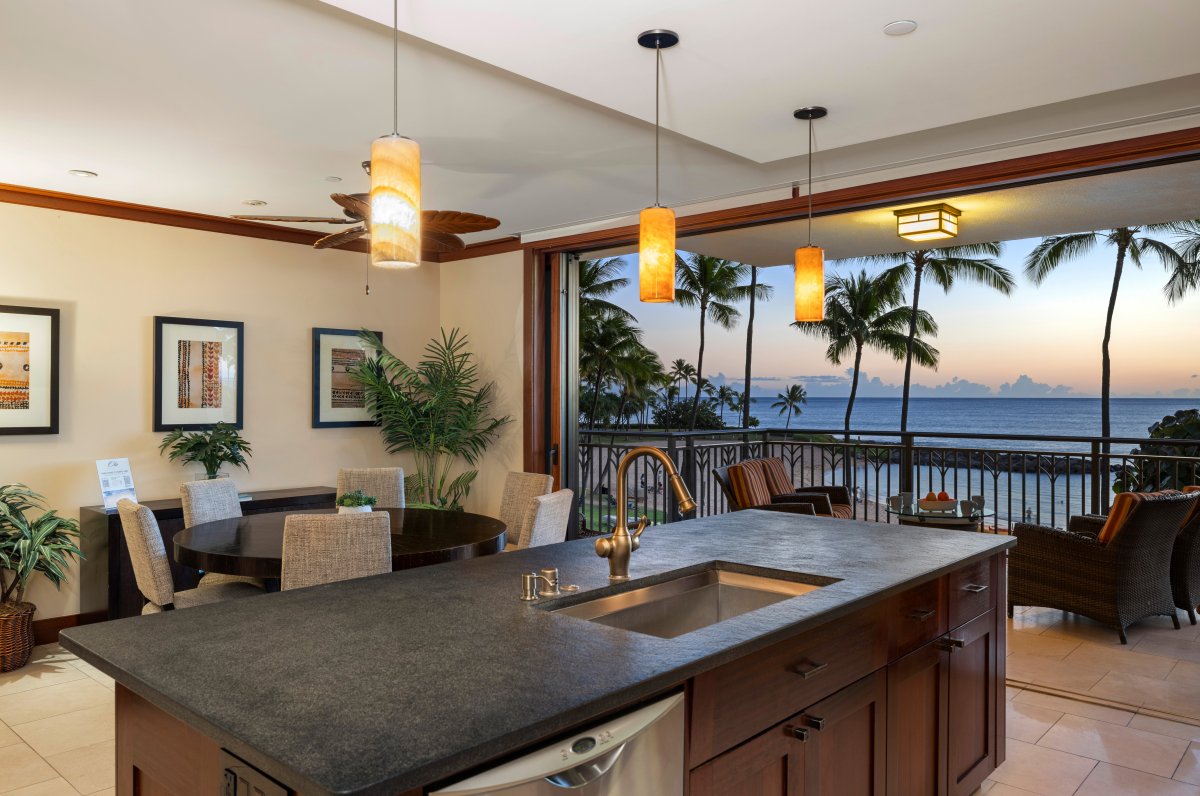 Gourmet kitchen with ocean views and island seating.